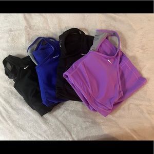 Lot if 4 Nike tanks with built in bra